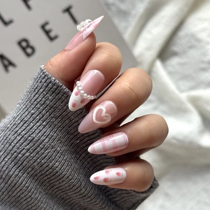 Pink plaid almond press-on nails with 3D bows, pearls, and cute strawberry designs