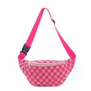 Close-up of pink checkered waist bag showing woven texture, strap buckle and gold zipper