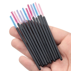 Disposable nylon eyelash and eyebrow brushes with colorful spiral heads and black handles