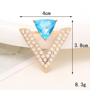 Triangle blue gemstone brooch with V-shaped gold metal frame and sparkling rhinestones