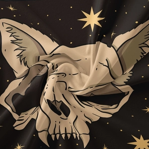 Macro detail of gothic cat skull tapestry showing high-quality fabric texture and star print