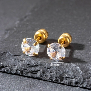 Macro shot of 6mm round zircon stud earrings with gold plating and screw backs