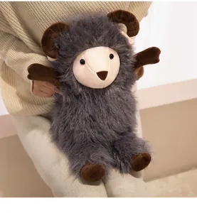 Detailed view of a soft grey plush goat doll with dark brown horns and fluffy fur texture