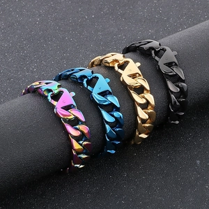 Detail view of colorful, blue, gold, and black cuban link bracelets on a display