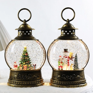 Christmas lantern snow globe with Santa and snowman motifs, glowing LED with snow effect