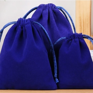 Three sizes of dark blue velvet drawstring pouches for jewelry storage and gift packaging