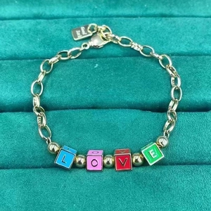 Golden chain bracelet with colorful LOVE enamel beads and round spacer accents
