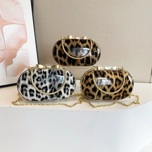 Chic leopard print clutch bags with gold metal frames and detachable chain straps