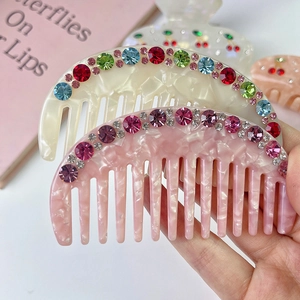 Chic acetate hair combs set with colorful rhinestones in cream and pink marble finish
