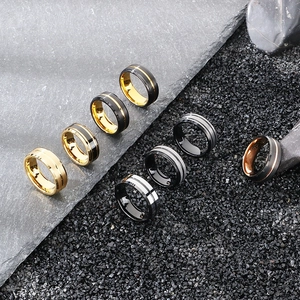 Detailed view of matte brushed tungsten rings in gold, black, silver and rose gold on rock