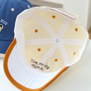 Cute bear baseball cap with flower embroidery showing internal structure and cotton fabric