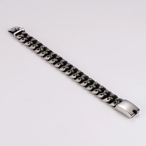 Macro view of vintage punk skull link chain bracelet with a secure metal fold-over clasp