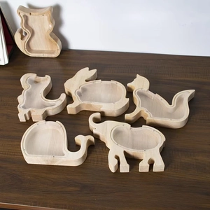 Various animal-shaped wooden piggy banks with transparent acrylic panels on wooden table