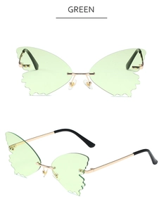Detail of green butterfly rimless lenses and gold metal frame with black temple tips