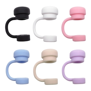 Close-up of silicone floral dust caps in black white pink blue beige and purple