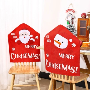 Detailed view of linen Christmas chair covers with Santa and Snowman cartoon embroidery
