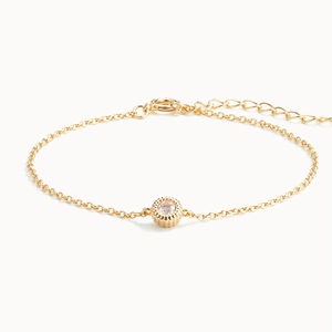 Minimalist S925 sterling silver gold bracelet with a single round sparkling gemstone