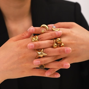 Golden 18K gold-plated stainless steel ring set featuring starfish and moon designs
