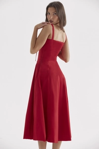 Elegant red maxi camisole dress with A-line silhouette and flowing hem detail