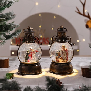 Detail of vintage bronze Christmas lanterns with snow globe scenes and warm LED lighting