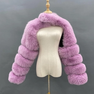 Detail shot of purple faux fur shawl with tiered segmented sleeves on a mannequin