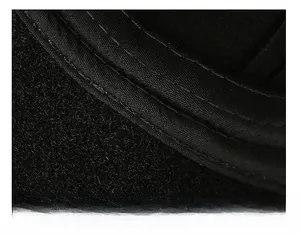 Detail view of the wide sweatband and fine stitching on a warm wool baseball cap