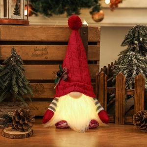 Lighted Christmas gnome ornament with red knitted hat and warm glowing LED beard