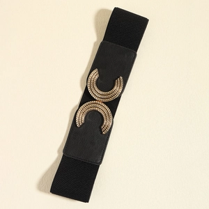 Close-up of elastic wide belt with golden dual-circle buckle and textured engraving