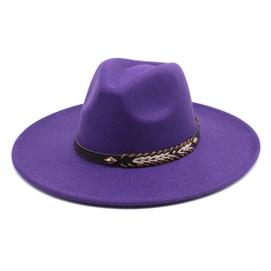 Dark purple wool jazz hat with a studded brown leather band on white background
