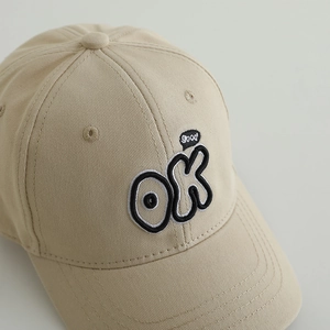 Kids minimalist cotton baseball cap with OK embroidery and curved brim in beige