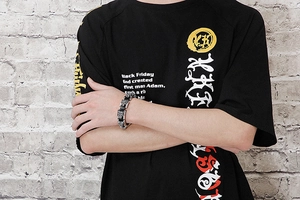 Detail of hip hop tiger head bracelet in stainless steel on male model wrist
