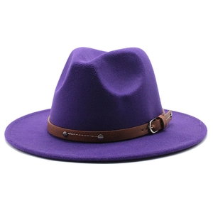 Detail of purple fedora hat featuring wool felt texture and brown leather belt buckle