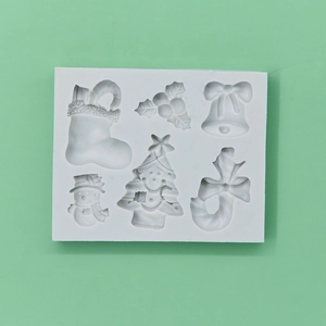 6-cavity Christmas silicone mold featuring snowman, tree, bell, and sock for DIY baking