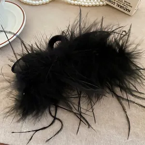 Elegant black feather rabbit ear claw clip for women's thick hair in stylish bun