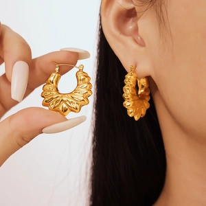 Vintage style textured hollow flower hoop earrings with 18k gold plating on titanium steel