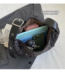 Detail view of leopard print tote bag interior capacity with brown striped lining