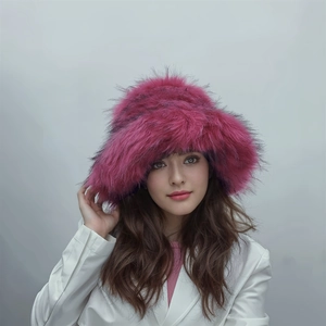 Detail of hot pink faux fur hat showing thick texture and fluffy winter aesthetic