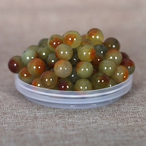 Macro view of polished round natural green jade beads for DIY bracelet making