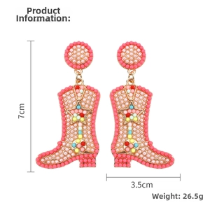 Detail view of pink boho beaded cowboy boot earrings with 7cm height and 3.5cm width