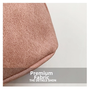 Close-up of pink woven textile fabric texture with soft micro-fiber finish on fashion bag