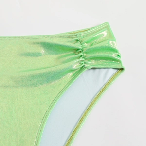 Detail of bright green metallic bikini bottom featuring ruched sides and high-quality lining