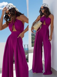 Close-up of halter neck cutout and textured fabric on purple wide-leg jumpsuit
