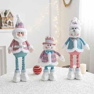 Pink and blue Christmas plush figurines of Santa, Snowman and Reindeer with long legs