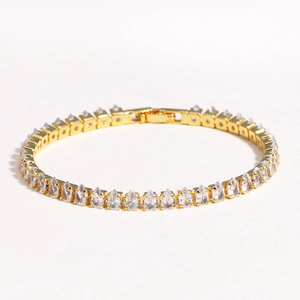 Detailed view of a gold-plated bracelet featuring a full circle of drop-shaped zircons