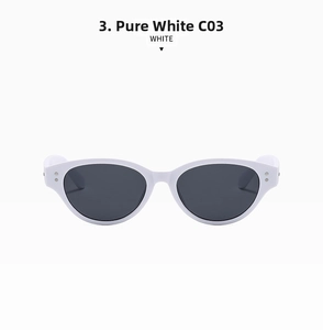 Detail view of white cat-eye sunglasses with metal hinge rivets and dark lenses