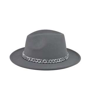 Detail shot of a gray wool fedora hat featuring a marble-effect acrylic chain band.