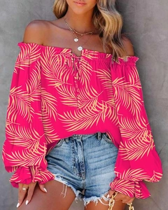 Detail of off-shoulder neckline with tie string on rose red palm leaf print blouse
