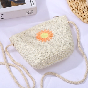 Beige woven straw crossbody bag with orange daisy embroidery for girls' summer outfits