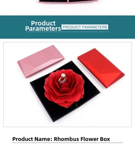 Detail of diamond-shaped jewelry box with pop-up rose flower and black ring holder