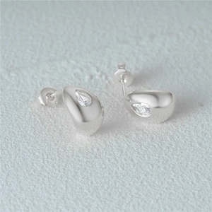 Close-up of S925 silver C-shape stud earring with teardrop-cut cubic zirconia stone